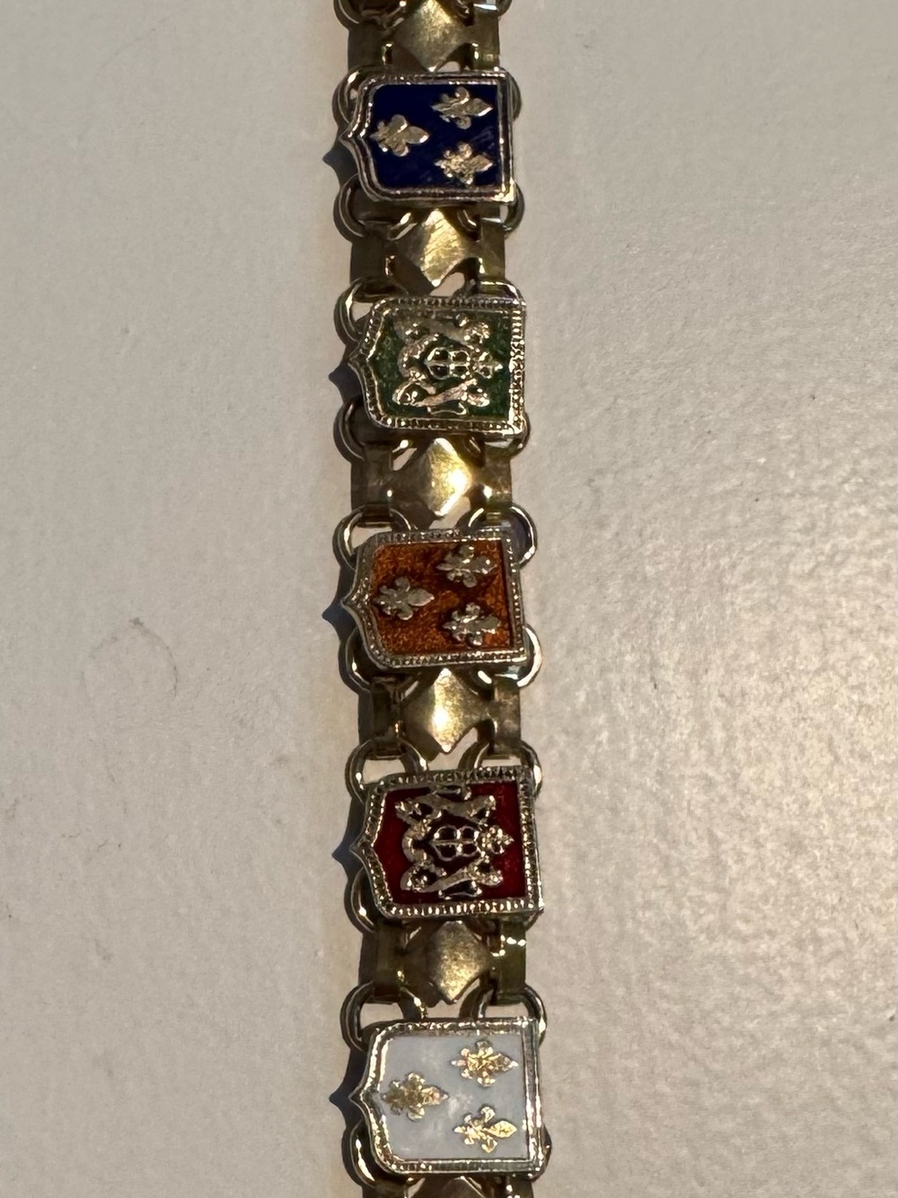 Vintage Gold Tone Travel Crown and Crest & Fleur de lid Shield Link Bracelet